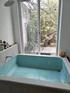 Huge bathtub, accessible from inside and the garden